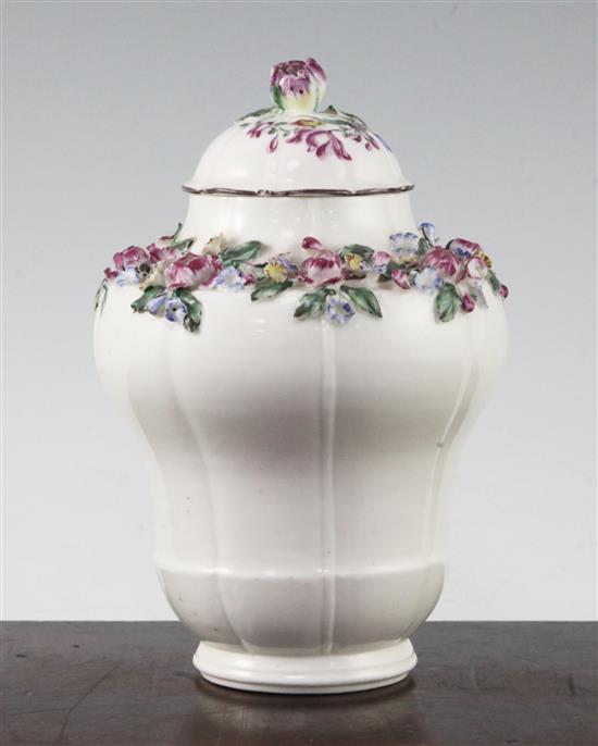 A Mennecy porcelain floral encrusted ogee-shaped vase and cover, c.1760, 17.5cm